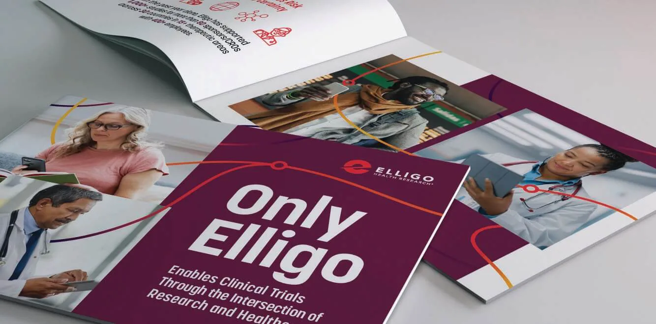 A set of Elligo Health Research brochures and pamphlets displayed on a table. The cover of one prominently features the phrase 'Only Elligo' along with the tagline 'Enables Clinical Trials Through the Intersection of Research and Healthcare.' The materials incorporate a modern design with a deep purple background, red and orange curved lines, and images of diverse individuals, including healthcare professionals and patients using digital devices.