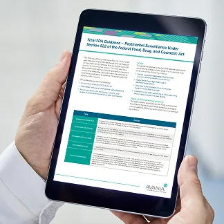 Close-up of a person holding a tablet displaying a professional document titled "Final FDA Guidance – Postmarket Surveillance Under Section 522 of the Federal Food, Drug, and Cosmetic Act" by Avania. The document includes structured sections with teal headings, bullet points, and a table summarizing relevant information. The background is minimal and softly lit, emphasizing the tablet's screen.
