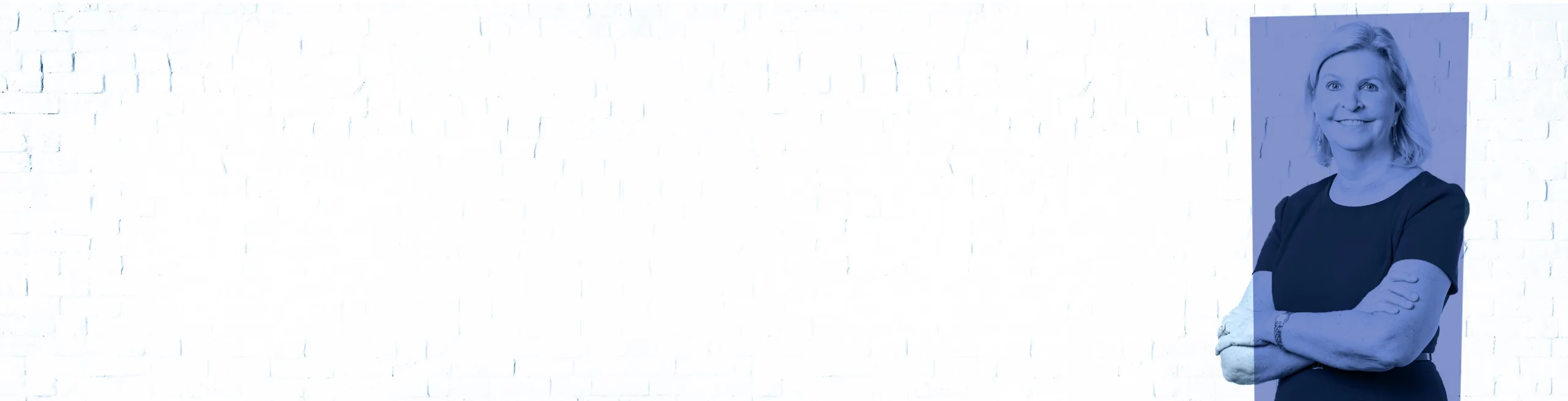 Stylized promotional image featuring Kaythe Richards from Sterling IRB standing confidently with arms crossed, smiling at the camera. She is positioned on the right side against a blue-tinted white brick background, leaving ample space on the left side—likely for text or branding purposes.