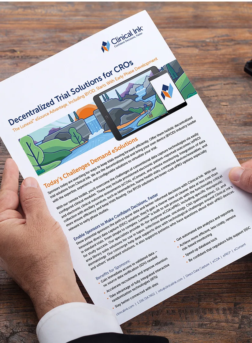 A pair of hands holds a single-sheet brochure titled “Decentralized Trial Solutions for CROs” beneath the Clinical Ink logo and tagline “Confident Decisions, Faster.” Below the headline, in smaller orange text, reads: “The Lunexis® eSource Advantage, Including BYOD, Starts With Early Phase Development.” Across the center is a wide, colorful illustration of a river valley landscape—with waterfalls, hills, and a sunset—overlaid by a tablet and smartphone displaying the same scene and the Clinical Ink icon. Underneath, the section titled “Today’s Challenges and Solutions” in orange is followed by two columns of body text describing how decentralized, bring-your-own-device (BYOD) eCOA/ePRO tools help sponsors overcome data-capture obstacles. Further down, a bulleted list of benefits for sponsors (e.g., “Gain immediate access to validated data,” “Accelerate recruitment and improve retention,” “Stay better connected with sites”) appears alongside a short list of platform capabilities in navy. The footer along the bottom shows Clinical Ink’s website, phone number, email address, and service offerings (“Direct Data Capture | eCOA | ePRO | eConsent”).