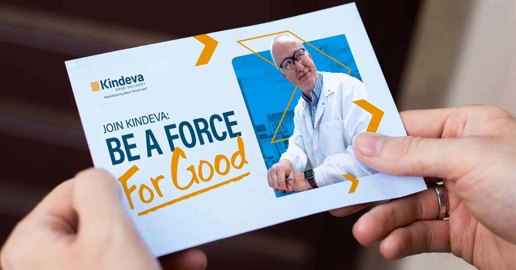A Kindeva Drug Delivery recruitment postcard with the message “Join Kindeva: Be a Force For Good” and a photo of a smiling scientist in a lab coat.