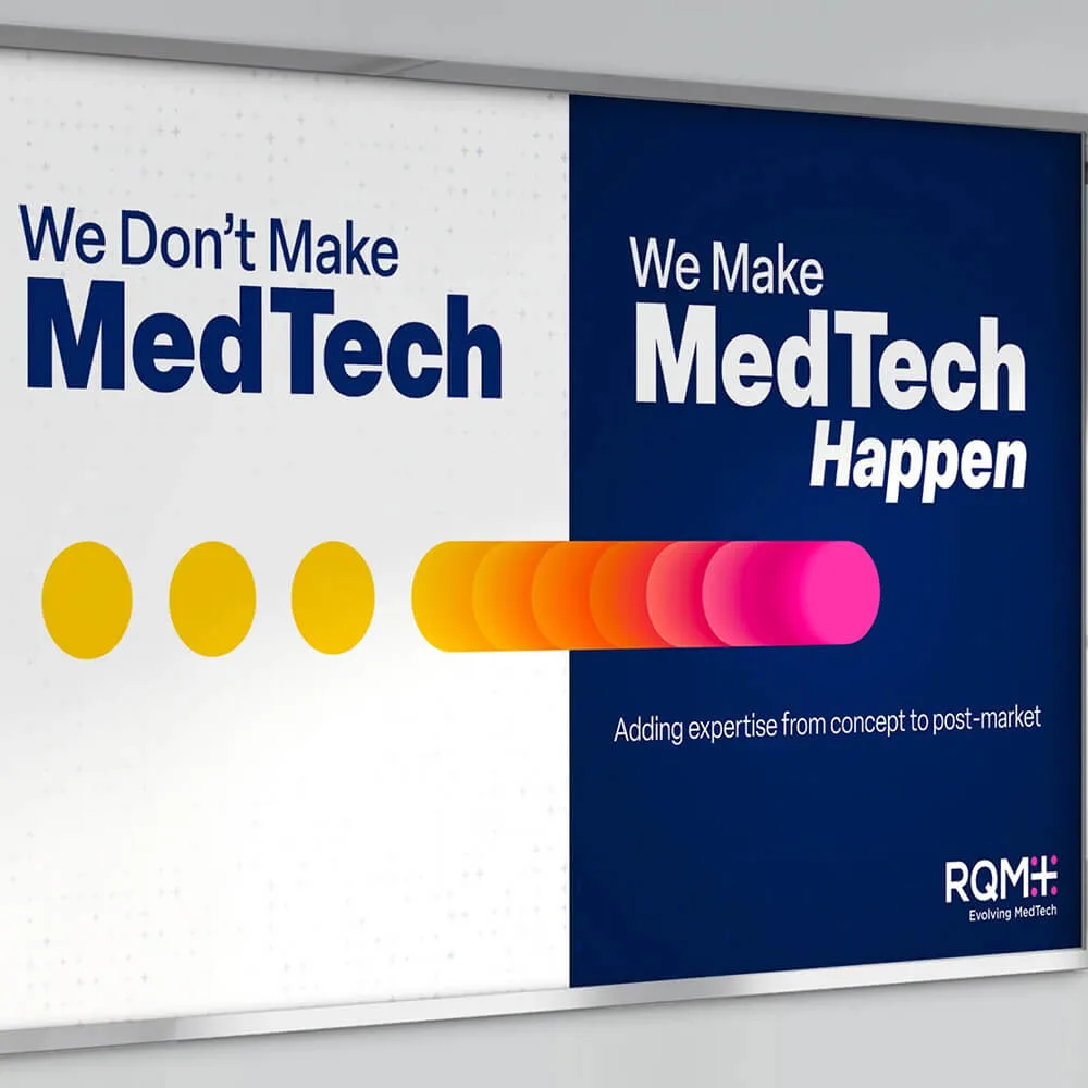 Marketing display with the text 'We Don’t Make MedTech, We Make MedTech Happen' featuring a progression of colored circles from yellow to pink. The slogan emphasizes expertise from concept to post-market, with the RQM+ logo and tagline 'Evolving MedTech' in the corner.