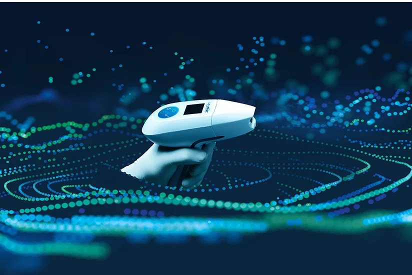 The image shows the UltraMIST® device, a hand-held therapeutic tool used for wound healing, surrounded by a dynamic blue and green light effect that represents its energy waves. The device is designed to deliver low-energy ultrasound to promote healing.