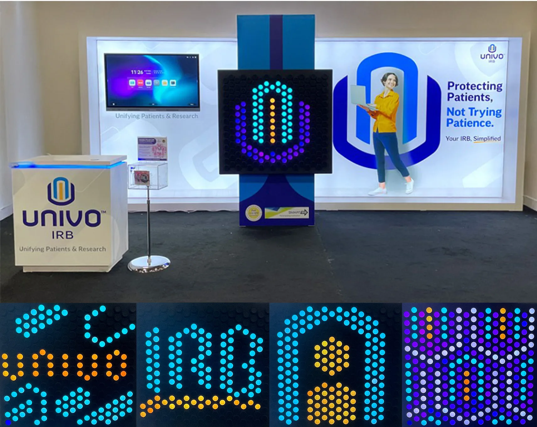 Univo IRB trade show booth display featuring branding elements from the Big Idea. The setup includes a backlit wall with the slogan 'Protecting Patients, Not Trying Patience. Your IRB, Simplified,' a display monitor, and a central Everbright board showing a colorful Univo logo made of illuminated pegs. A branded counter and a giveaway box are placed in front. Along the bottom, close-up images show various stages of the logo and word 'Univo' being created with pegs on the Everbright board.