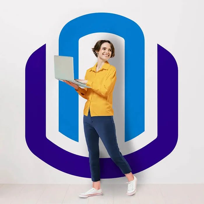 Smiling woman in a yellow shirt and blue pants holding a laptop, standing in front of a wall with a large stylized 'U' in blue and purple, possibly representing a technology or education brand.