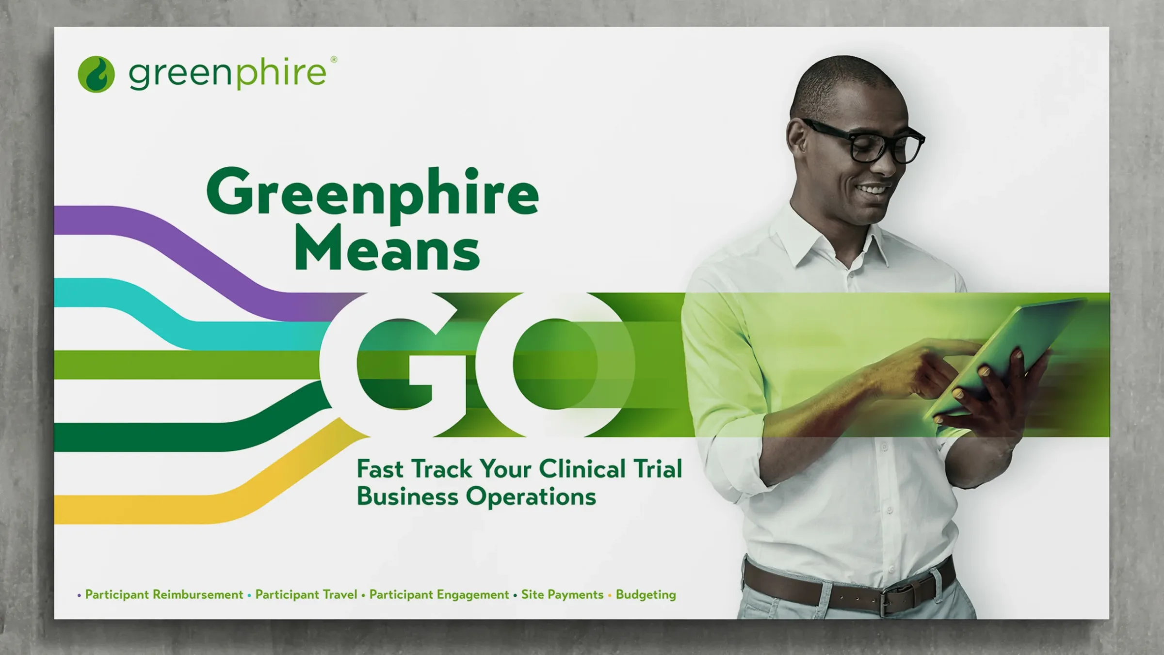 Promotional banner for Greenphire featuring a smiling man using a tablet, overlaid with green motion lines. Text reads 'Greenphire Means GO – Fast Track Your Clinical Trial Business Operations,' with a list of services like participant reimbursement, site payments, and budgeting.