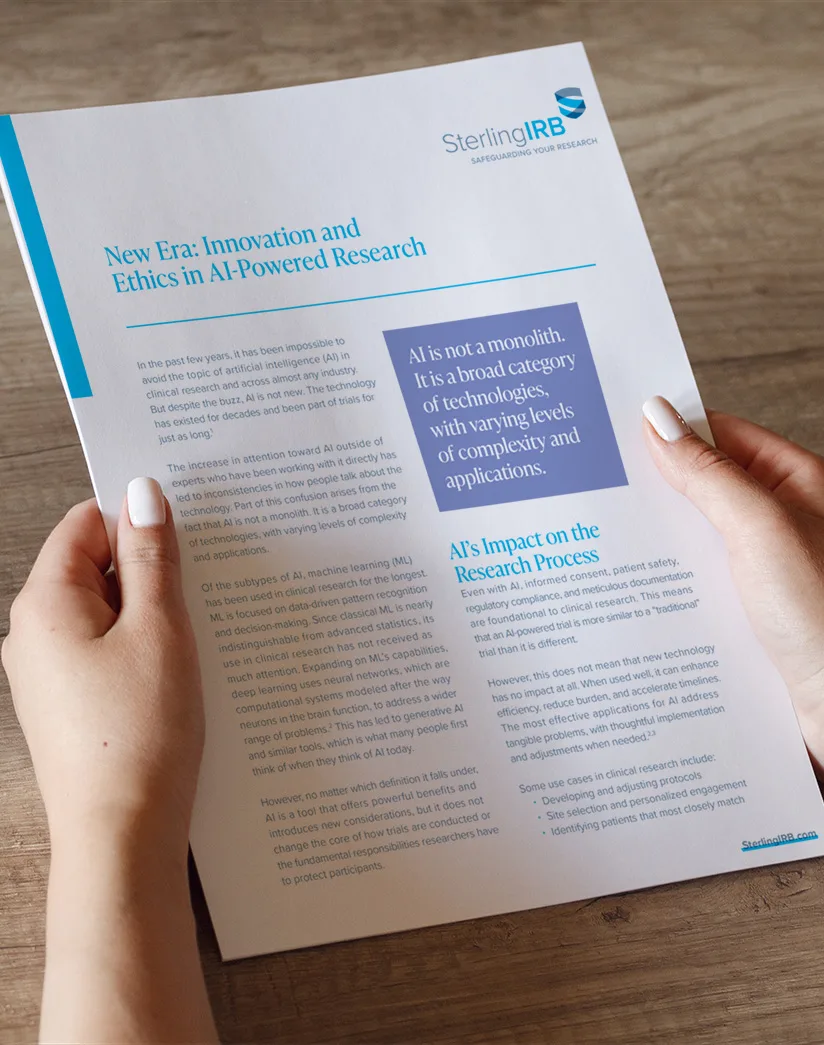 A printed white paper titled “New Era: Innovation and Ethics in AI-Powered Research,” discussing the impact of artificial intelligence on clinical research ethics and regulatory processes.