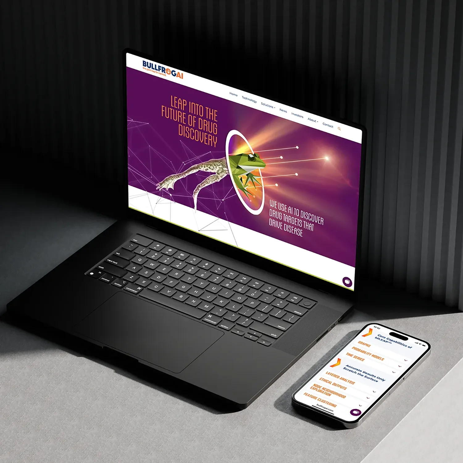 Laptop and smartphone displaying the BullFrog AI website with a stylized frog graphic and messaging about AI-powered drug discovery, demonstrating life science marketing for biotechnology innovation.