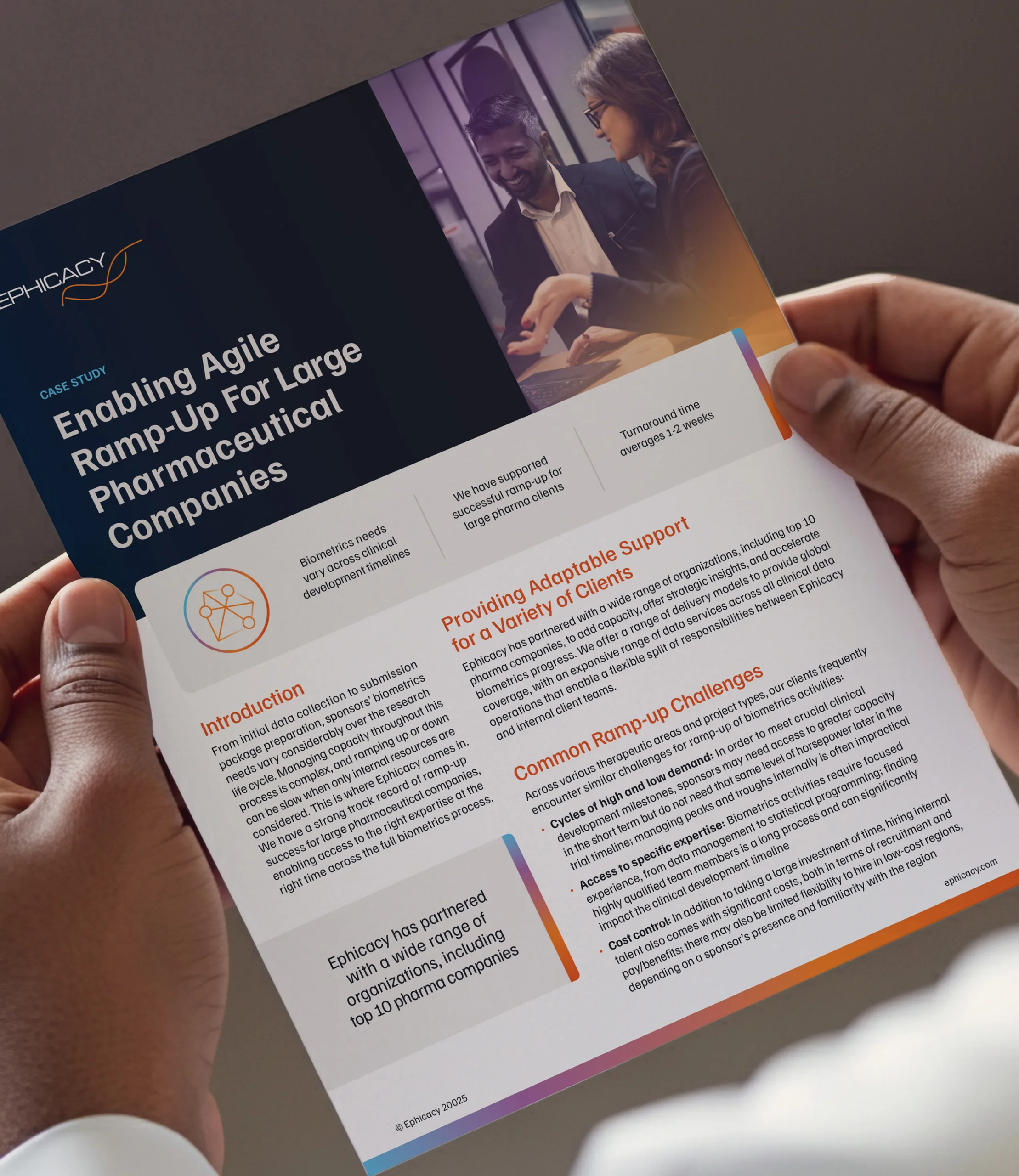 Person holding a printed case study titled Enabling Agile Ramp-Up for Large Pharmaceutical Companies with sections describing biometrics support, challenges, and client outcomes