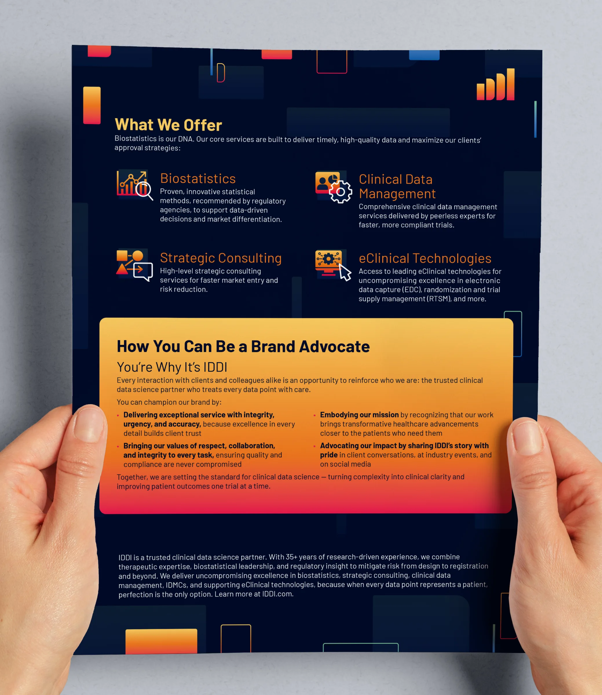 Printed sell sheet held by hands showing IDDI services and brand advocacy messaging